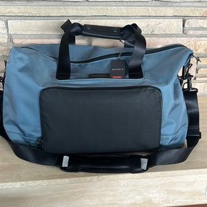 Tumi alpha 3 double expansion travel satchel. Never been used.